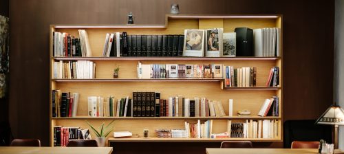 best organizing tips: an organized, wall-mounted bookcase