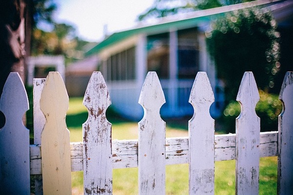 Closeup of a white picket fence