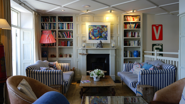 a living room with a big bookshelf 