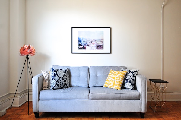 a well-lit room and a sofa