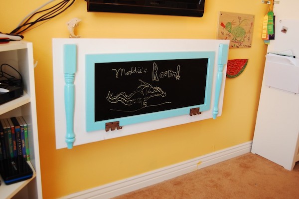 a folding desk is mounted against the wall 