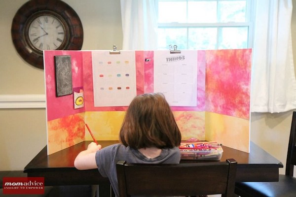 a child studies at her DIY homework station