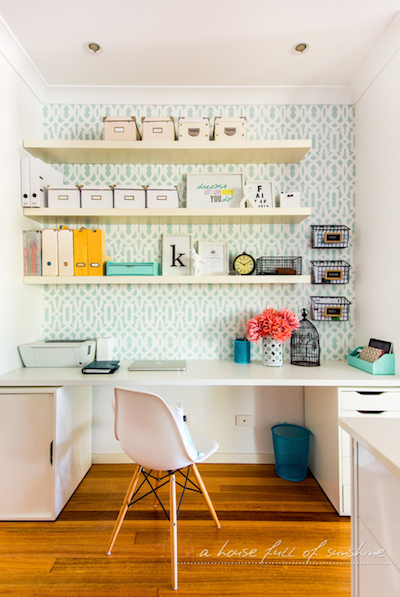 a self-made study nook with a desk and floating shelves