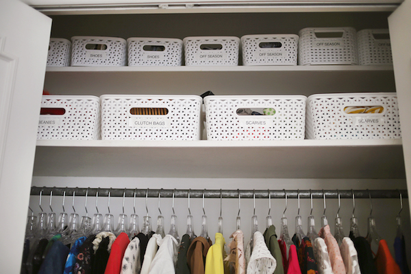 labeled storage boxes in the closet