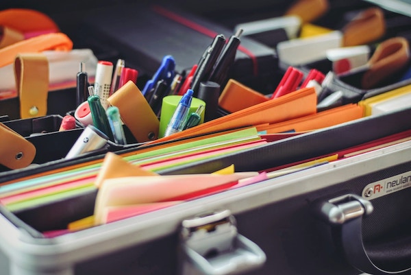 pens and files packed into a briefcase