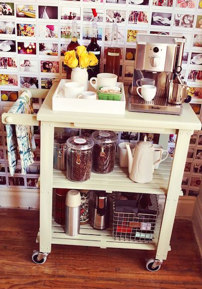 a white rolling cart has been styled as a portable espresso vessel