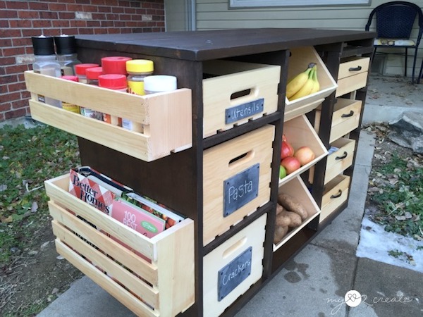 A handmade kitchen storage island with drawers that pop and slide open