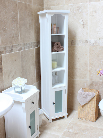 a narrow white corner bathroom shelving unit with a cabinet