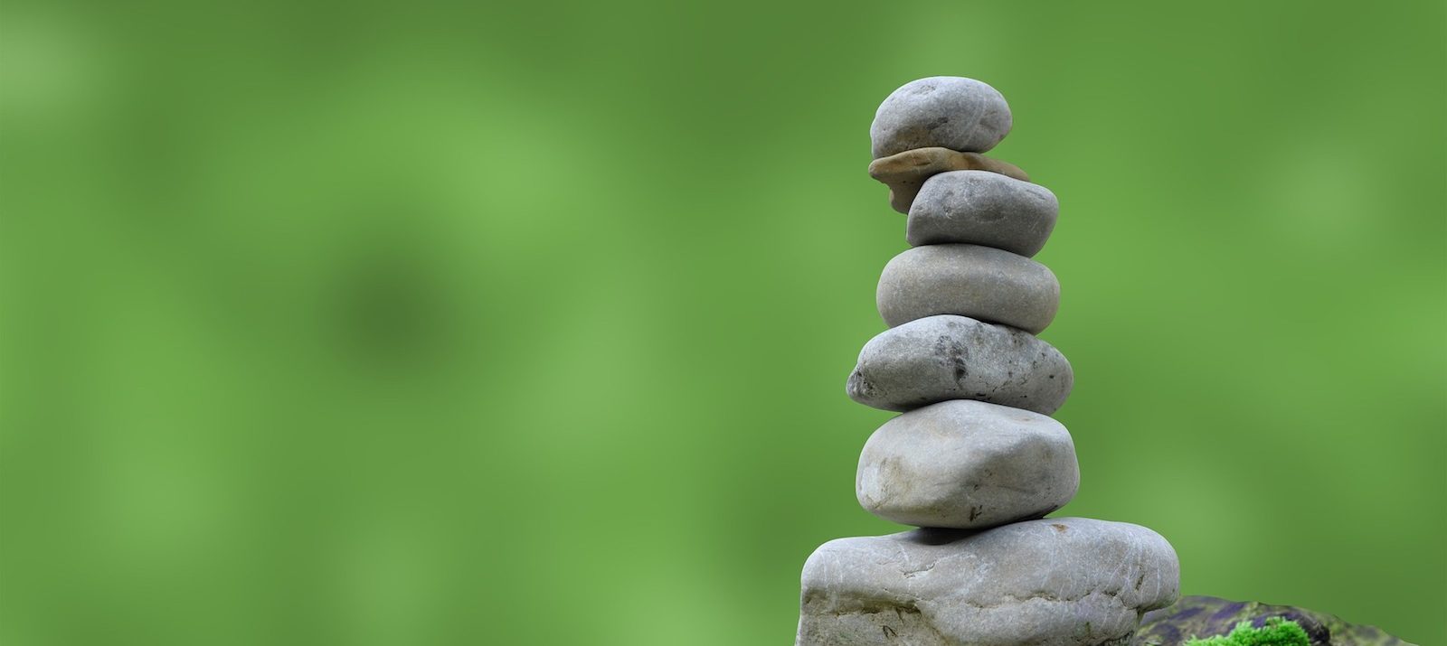 zen rocks stacked to increase positive energy and peace