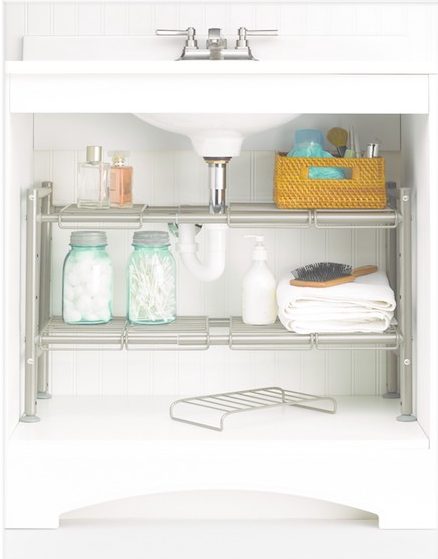 an 88 main expandable under sink storage rack storing toiletries underneath a bathroom sink