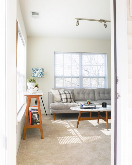 a well-lit room in a railroad apartment