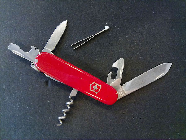 swiss army knife on black background