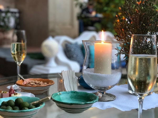 a candle lit on a cozy table