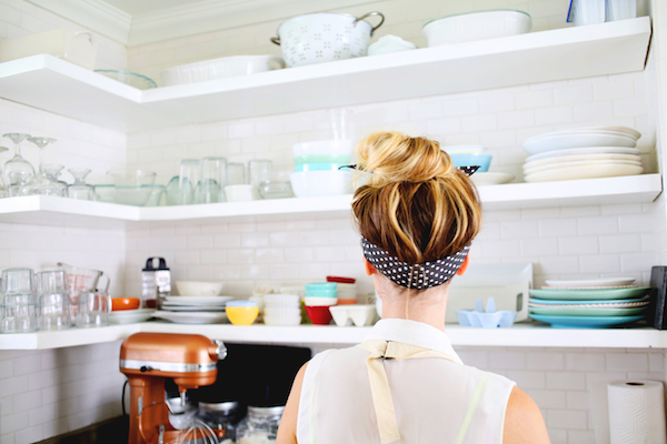 closeup of a woman who's wearing an apron in her kitchen