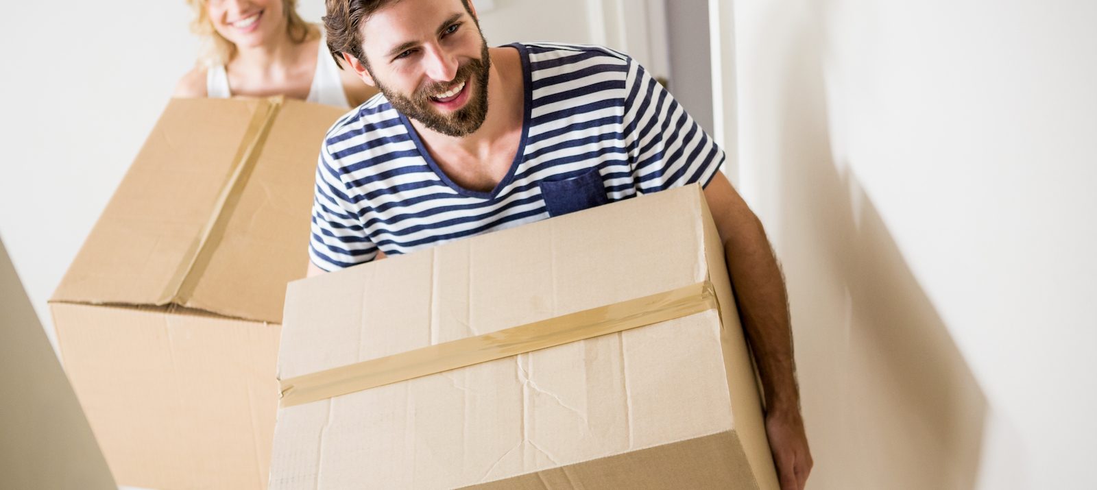 carrying boxes moving out of apartment