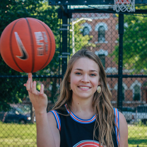 Hannah from Cool Cousin spins a basketball on her finger