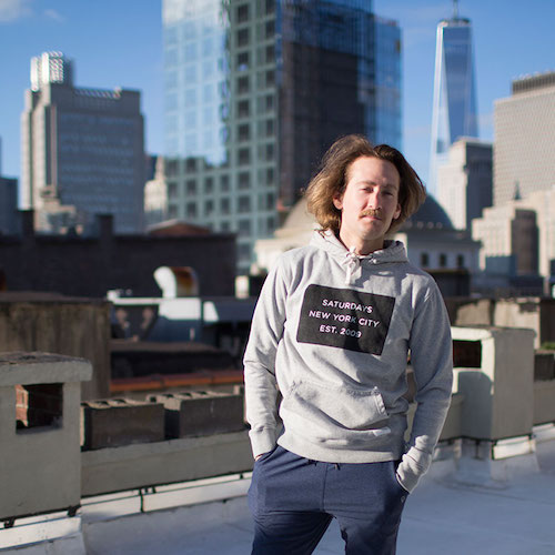 Max from cool cousin standing on a rooftop in NYC 
