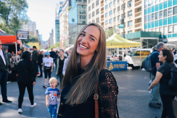 Natalie from cool cousin smiles at the farmers market