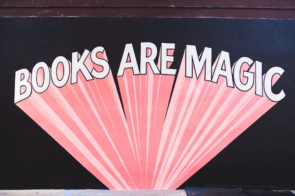 the mural outside the bookstore Books Are Magic