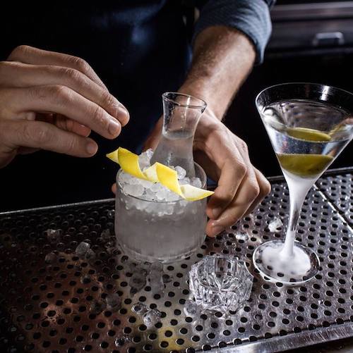 a bartender makes a concoction