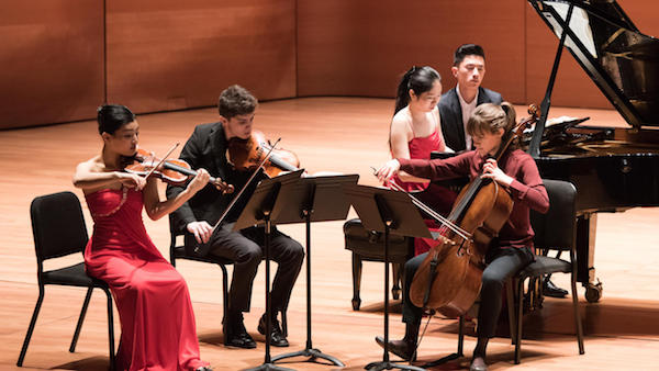 students performing chamber music onstage