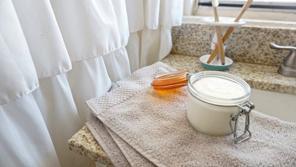 toiletries in a sunny bathroom without any plastic packaging