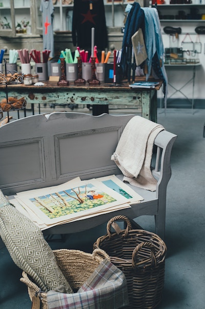 artwork lies on a bench next to some cloth that will cover it