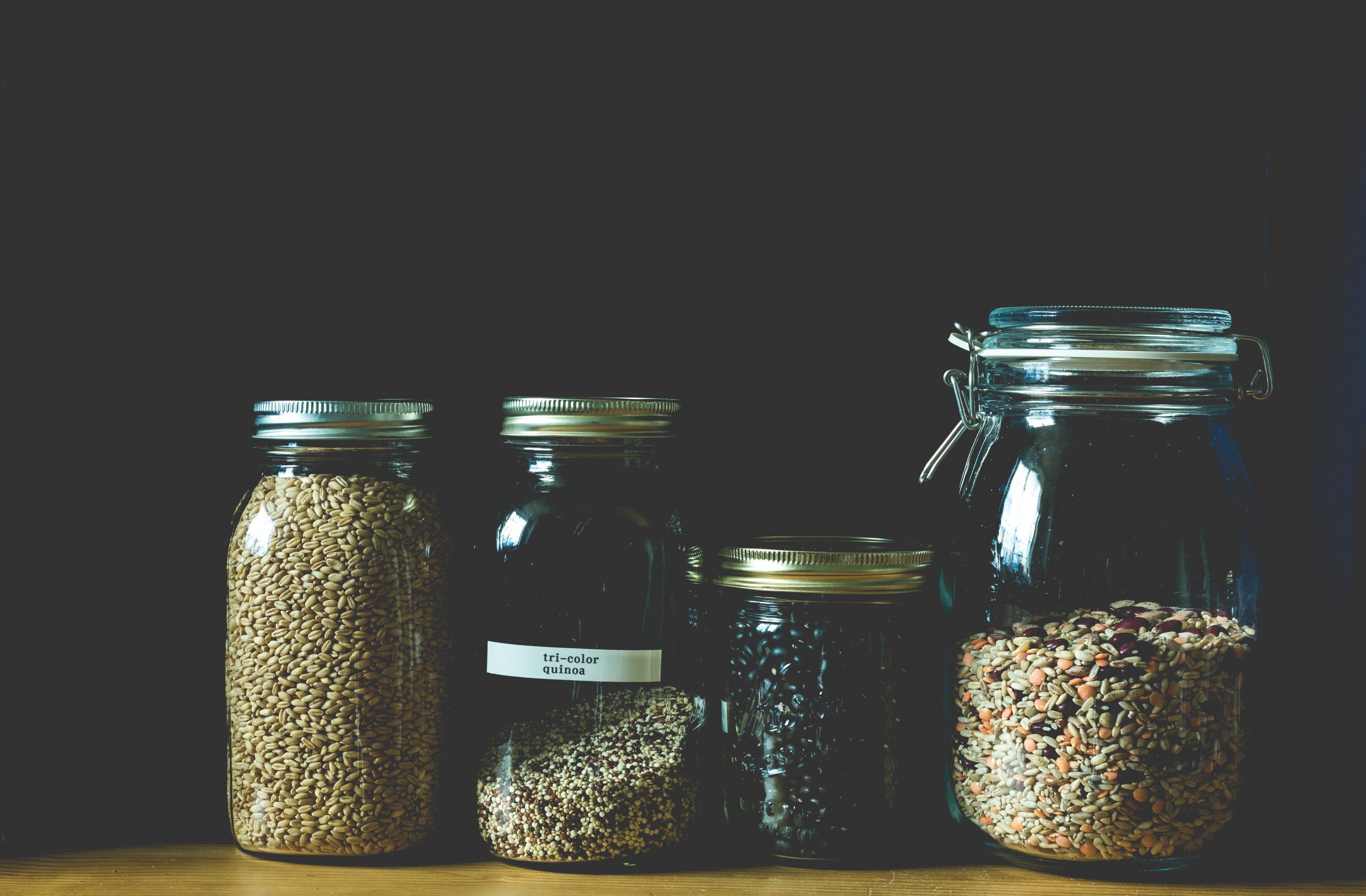 a collection of dried goods in mason jars