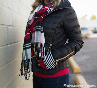 black puffer coat with plaid scarf and red sweater