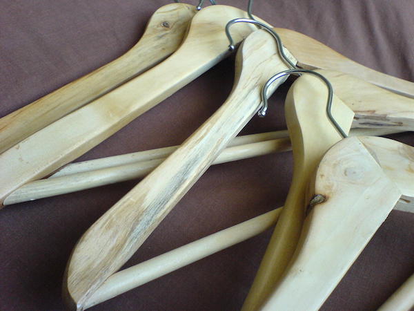 wooden hangers on black sheet