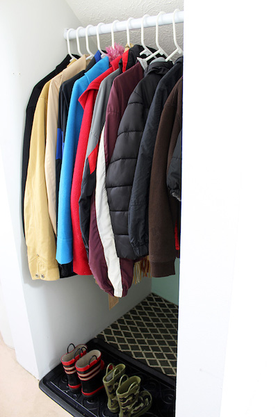 coats in dry dark coat closet