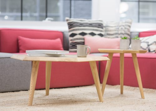 pops of pink decor in a living room