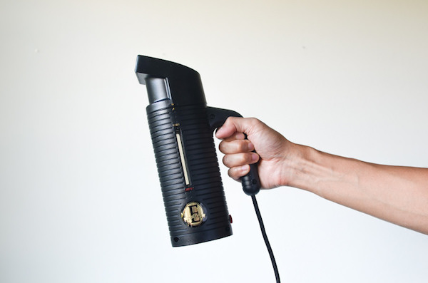 black handheld clothes steamer