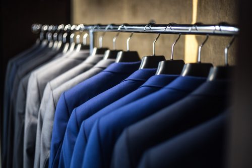 blue-suit-jackets-hanging