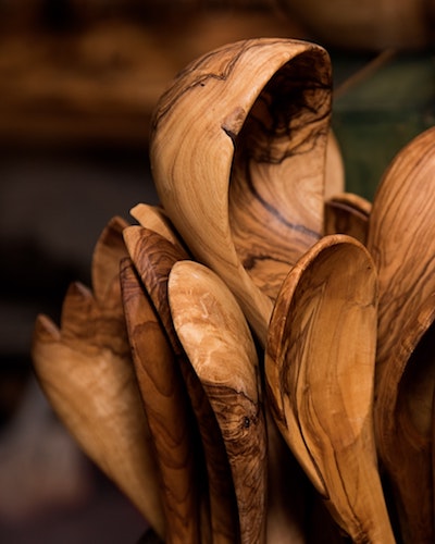multiple wooden spoons grouped together