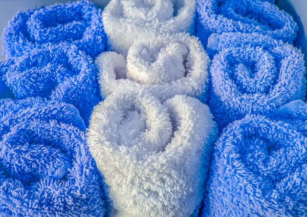 blue and white towels rolled
