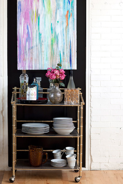 bar cart used for kitchen utensil storage