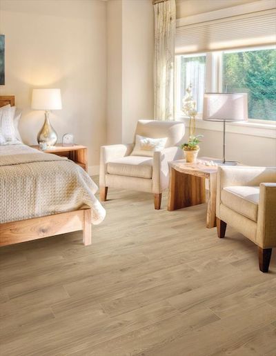 light bamboo wood flooring in neutral bedroom