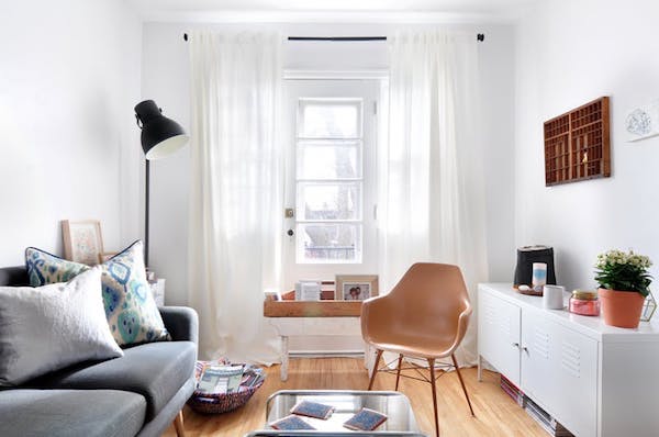 sheer white curtains in an apartment living room