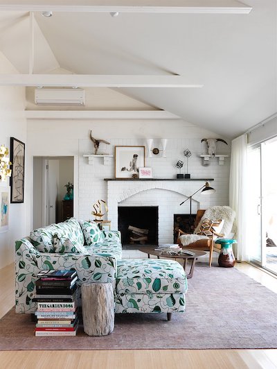 white and green leaf printed sectional in living room