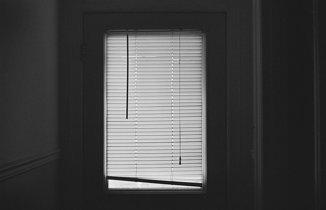 a dark window in a bedroom