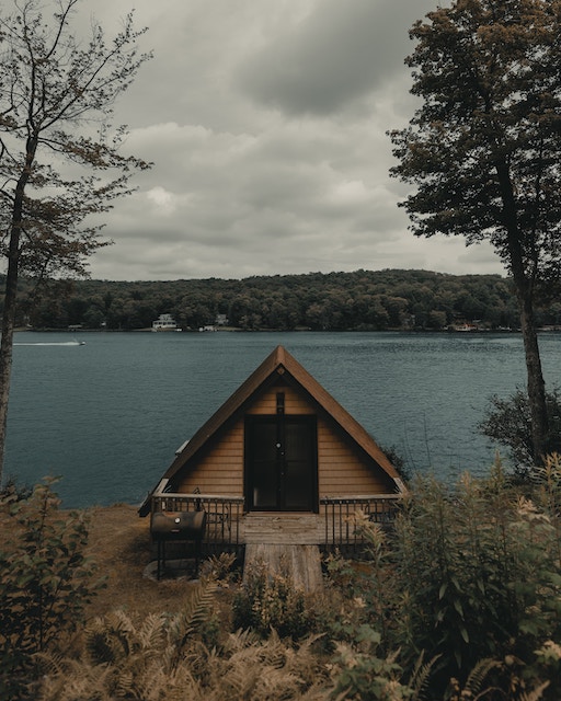 a tiny house by a lake