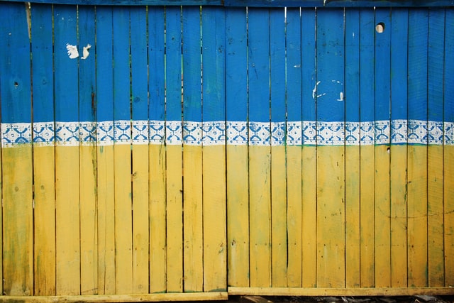 a bright yellow and blue fence 