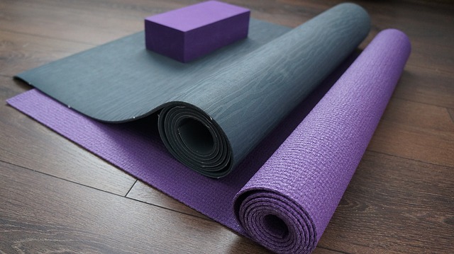 two yoga mats on a hardwood floor