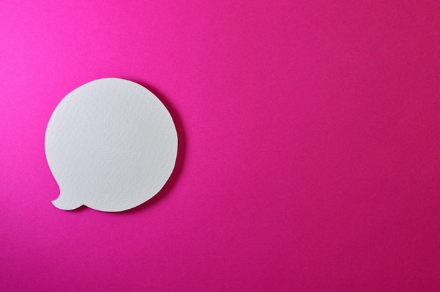a pink background with a speech bubble crafter out of paper