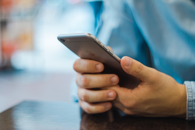 a man holding a mobile phone