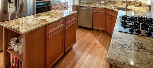 A kitchen island with a side cupboard