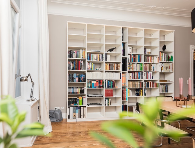 A library with plants in the foreground