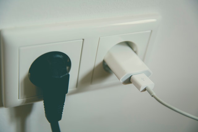 Two chargers plugged into two power outlets