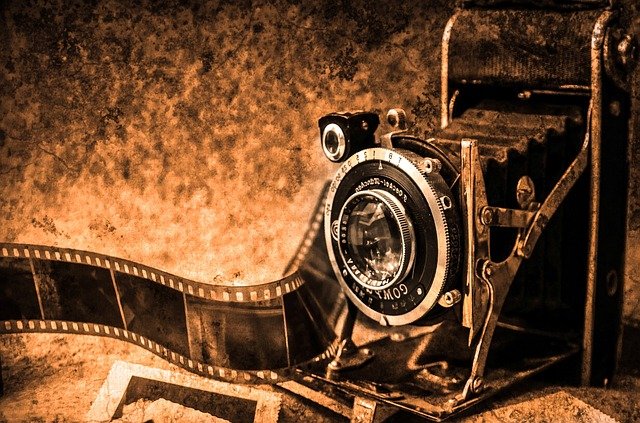 A sepia-set old camera with film